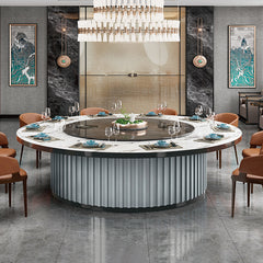 酒店包廂電動餐枱,宴會廳大圓枱,家居電動轉盤餐枱,豪華圓形設計配旋轉轉盤,周圍環繞優雅座椅,置於精緻室內空間,適合高端宴會用餐。Luxury hotel private room electric dining table with rotating turntable, surrounded by elegant chairs in a sophisticated interior, ideal for upscale banquets.electric rotating dining table Hong Kong,luxury sintered stone dining table,