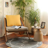 鋁合金時尚搖椅配米色坐墊與黃色靠枕,窗邊休閒角落欣賞湖景山色 | Aluminum alloy rocking chairs with beige cushions and yellow pillows, window relaxation corner with lake and mountain view