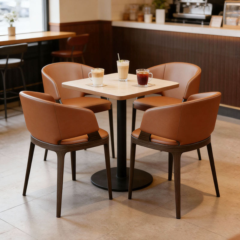 奢華餐廳餐椅設計，輕奢餐椅，多款風格包括棕色皮革扶手椅、木質框架與軟墊座面，置於現代室內環境，提供舒適用餐座位。Luxury restaurant dining chairs in various styles, including brown leather armchairs with wooden frames and cushioned seats in modern settings for comfortable dining.minimalist dining chair hong kong、velvet dining chair、leather armchair cafe.